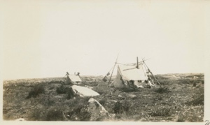 Image of Tents with stove pipes